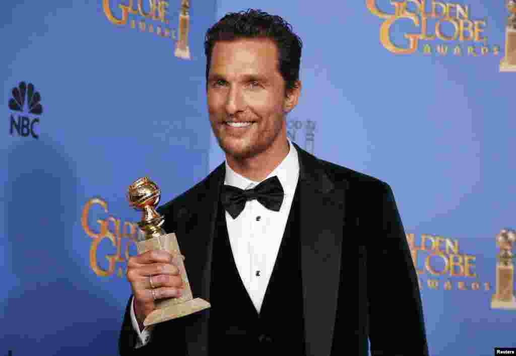 Matthew McConaughey poses with his award for Best Actor in a Motion Picture, Drama for his role in "Dallas Buyers Club" at the Golden Globe Awards in Beverly Hills, California, Jan. 12, 2014.