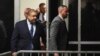 Manhattan District Attorney Alvin Bragg, left, returns to the courtroom following a break during a hearing about Donald Trump's hush money trial at Manhattan Criminal Court in New York on March 25, 2024. Bragg sought, and was granted, a gag order against Trump.