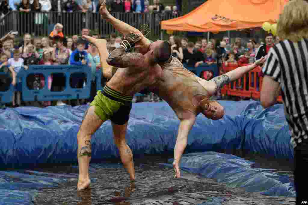 Competitors take part in the 10th annual World Gravy Wrestling Championships held at the Rose 'n' Bowl Pub near Bacup, north west England.