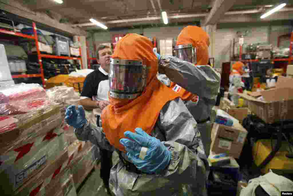The worst-hit countries - Liberia, Sierra Leone and Guinea - still have far too few Ebola bedspaces - 25 percent of the number needed - and too few firm commitments of help from foreign medical teams, the WHO said. Here, volunteers are taught how to work with patients infected with Ebola before traveling to Africa, near Paris, Oct. 22, 2014.