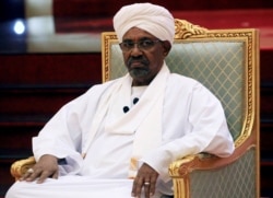 FILE - Omar al-Bashir, then Sudan's president, addresses the National Dialogue Committee meeting at the Presidential Palace in Khartoum, Sudan, April 5, 2019.