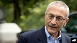 FILE - John Podesta speaks to reporters in Washington, Oct. 5, 2016.