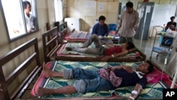 This Aug. 26, 2009 photo shows patients suffering from malaria being treated at the hospital in Pailin, Cambodia. 