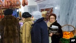 Customers line to stock up for the New Year in GUM Department Store in Red Square in Moscow, Russia, Dec. 29, 2015.
