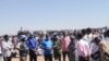 Peacekeepers from the United Nations Hybrid Operation receive a petition from protesters in Darfur, Jan. 13, 2021.