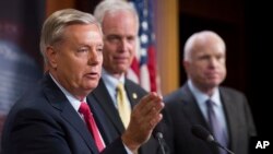 From left, Sen. Lindsey Graham, R-S.C., Sen. Ron Johnson, R-Wis., and Sen. John McCain, R-Ariz., speak to reporters at the Capitol. McCain joined two other Republican senators to defeat a measure to partly repeal the Affordable Care Act. 