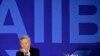 FILE - Jin Liqun, inaugural president of the Asian Infrastructure Investment Bank (AIIB), gestures as he speaks during a press conference at a hotel in Beijing, Jan. 17, 2016. 
