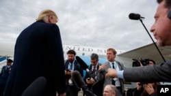 President Donald Trump listens to a question about the missing Saudi journalist Jamal Khashoggi after landing at Cincinnati Municipal Lunken Airport, Oct. 12, 2018, in Cincinnati, Ohio.