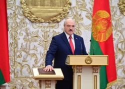 FILE - Belarusian President Alexander Lukashenko takes his oath of office during his inauguration at the Palace of the Independence in Minsk, Belarus, Sept. 23, 2020.