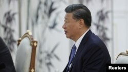 Russian President Vladimir Putin meets with Chinese President Xi Jinping in Samarkand