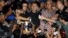 This Antara Foto image shows Bambang Widjojanto, center, deputy chairman of the the Anti-Corruption Commission, speaking to reporters after his release at police headquarters in Jakarta, Jan. 24, 2015.