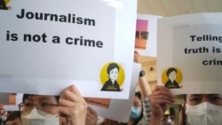 FILE - Press freedom advocates rally outside a court in Hong Kong, April 22, 2021.