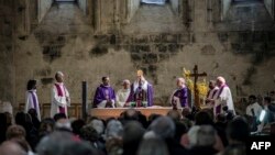 Priests celebrate a religious ceremony for victims of a Germanwings flight that crashed in the French Alps, killing all 150 aboard, on March 28, 2015, at Notre-Dame-du-Bourg cathedral in Digne-les-Bains, near the site of the crash.