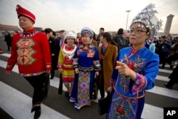 Delegates in ethnic minority dress arrive for the opening session of China's National People's Congress (NPC) at the Great Hall of the People in Beijing, March 5, 2018.