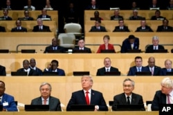 President Donald Trump participates in a photo before the beginning of the "Reforming the United Nations: Management, Security, and Development" meeting during the United Nations General Assembly, Monday, Sept. 18, 2017