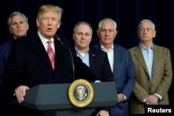 U.S. President Donald Trump speaks to the media after the Congressional Republican Leadership retreat at Camp David, Maryland, Jan. 6, 2018.