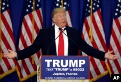 FILE - Republican presidential candidate Donald Trump speaks during a news conference at the Trump National Golf Club in Jupiter, Florida, March 8, 2016.