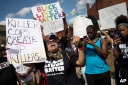 FILE - Protesters rally during a Black Lives Matter demonstration in Cincinnati, July 10, 2016.