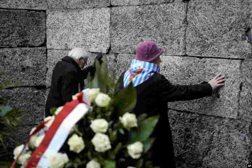 Survivors and relatives attend a ceremony at the Auschwitz-Birkenau former Nazi German concentration and extermination camp, in Oswiecim, Poland.