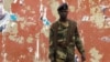 A soldier stands guard in a street near the National Assembly on April 13, 2012 in Bissau.