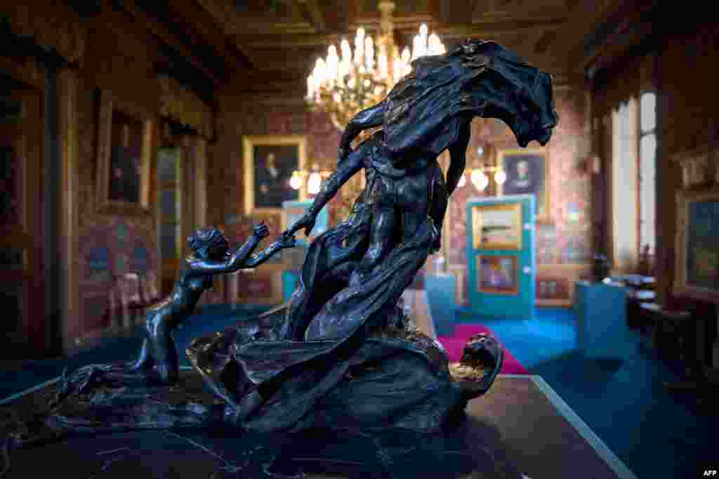 The bronze sculpture "L'Age mur" (The Mature Age) by French sculptor Camille Claudel (1864-1943), is sold for 3.1 million euros during an auction in Orleans, France, Feb. 16, 2025. The sculpture was found by chance in an uninhabited flat in Paris on Dec. 16, 2024. 