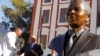 South African President Jacob Zuma (second l) talks with Mandla Mandela (l) after they and other dignitaries unveiled a bust of former South African President Nelson Mandela (r) at the South African Parliament in Cape Town, South Africa, April 28, 2014.