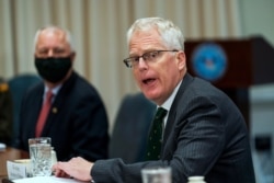FILE - Acting U.S. Secretary of Defense Christopher Miller speaks during a meeting at the Pentagon, in Arlington, Virginia, Nov. 13, 2020.