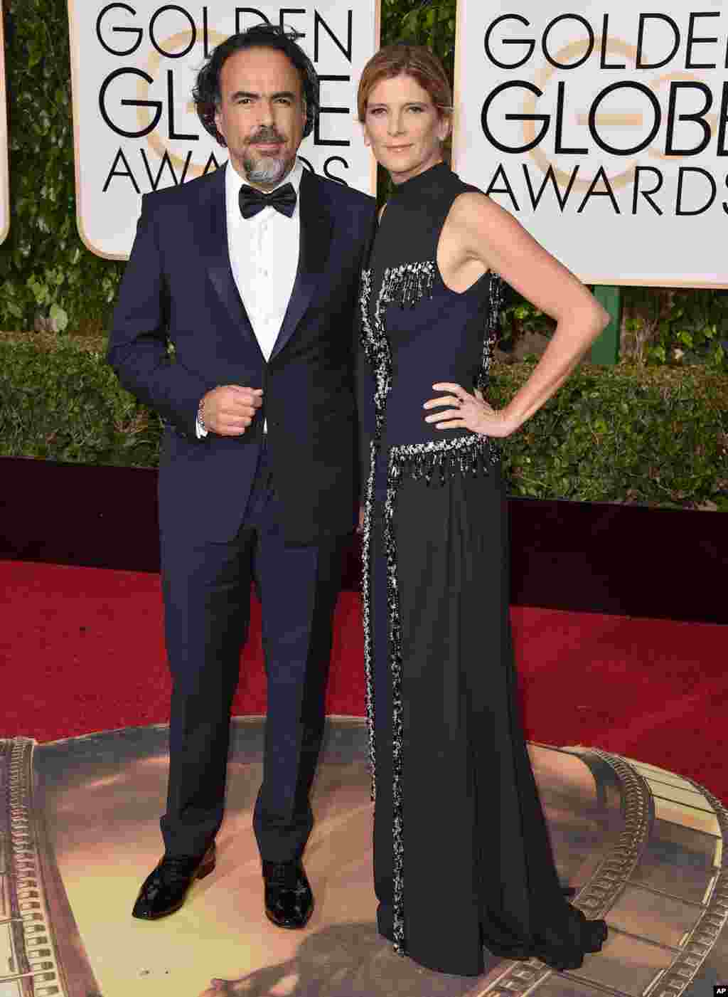 Alejandro Gonzalez Inarritu, left, and Maria Eladia Hagerman arrive at the 73rd annual Golden Globe Awards on Jan. 10, 2016, at the Beverly Hilton Hotel in Beverly Hills, Calif.