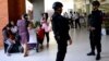 FILE - Indonesian Special Police patrol at Ngurah Rai Airport in Denpasar on Bali, Jan. 15, 2016, one day after a series of explosions hit the Indonesian capital, Jakarta. Islamic State suicide bombers and gunmen executed a Westerner in Jakarta and blew up a Starbucks.