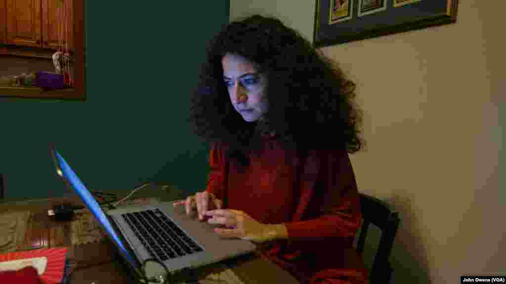 Clown Me In founder Sabine Choucair edits a video piece, which focuses on Lebanon's trash crisis -- in her home in Beirut.