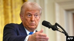 US President Donald Trump speaks during a press conference with unseen Israel's Prime Minister Benjamin Netanyahu in the East Room of the White House in Washington, DC, on February 4, 2025. (Photo by ANDREW CABALLERO-REYNOLDS / AFP)