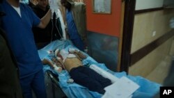 A Palestinian child wounded in an Israeli bombardment is treated at the hospital in Deir al Balah, Gaza Strip, on Dec. 2, 2023.
