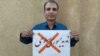 رضا مهرگان، فعال مدنی زندانی