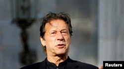 FILE - Pakistan's Prime Minister Imran Khan speaks during a joint news conference with Afghan President Ashraf Ghani (not pictured) at the presidential palace in Kabul, Afghanistan, Nov. 19, 2020.