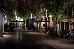 A shopping street in Bonn is empty at the beginning of a month-long COVID-19 lockdown in Germany, Nov. 2, 2020.