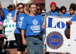 United Auto Workers union members march in the Labor Day Parade in Detroit, Michigan, Sept. 2, 2019.