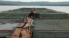 Demonstration fish farming cages on the Nile River in Jinja, Uganda, Sept 24, 2013. (Hilary Heuler/VOA)