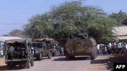 FILE - Kenya Defence Forces soldiers arrive at the scene of an attack claimed by al-Shabab militants in the northeastern town of Mandera, Kenya, Oct. 25, 2016. Security officials say 10 suspected al-Shabab militants were killed Jan. 18, 2023, at a hideout in Garissa County. 