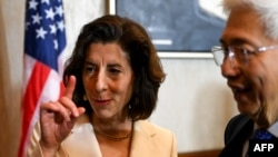 U.S. Commerce Secretary Gina Raimondo and Philippine Department of Trade and Industry Secretary Alfredo Pascual attend a press conference in Paranaque City, Philippines, on March 11, 2024. Raimondo announced a plan for the U.S. to invest $1 billion in the nation's tech sector.