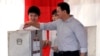 Jakarta Governor Basuki "Ahok" Tjahaja Purnama, who is seeking his second term in office, files his ballot at a polling station during the runoff election in Jakarta, Indonesia, April 19, 2017.
