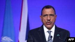(FILES) Niger's President Mohamed Bazoum presents his national statement as part of the World Leaders' Summit of the COP26 UN Climate Change Conference in Glasgow, Scotland on November 1, 2021.