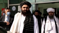 The Taliban delegation led by Amir Khan Muttaqi, the acting foreign minister, front, at Esenboga Airport, arrive in Ankara, Turkey, Oct. 14, 2021.