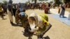 Thousands of displaced persons from Abyei collect food rations in a makeshift camp in Turalei, southern Sudan. (File Photo - May 27, 2011) 
