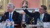 Britain's Defense Secretary Sir Michael Fallon, left, and U.S. Secretary of Defense Ash Carter are pictured at the Foreign Office in London during a summit with defense ministers from the coalition of countries fighting Islamic State forces, Dec. 15, 2016.