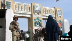 FILE - A Pakistani soldier keeps guard at the Friendship Gate, crossing point at the Pakistan-Afghanistan border town of Chaman, Pakistan, March 7, 2017.