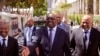 South Africa Finance Minister Nhlanhla Nene, center, arrives at parliament to deliver the annual South Africa budget speech to Parliament in Cape Town, South Africa, Wednesday, Feb. 25, 2015.