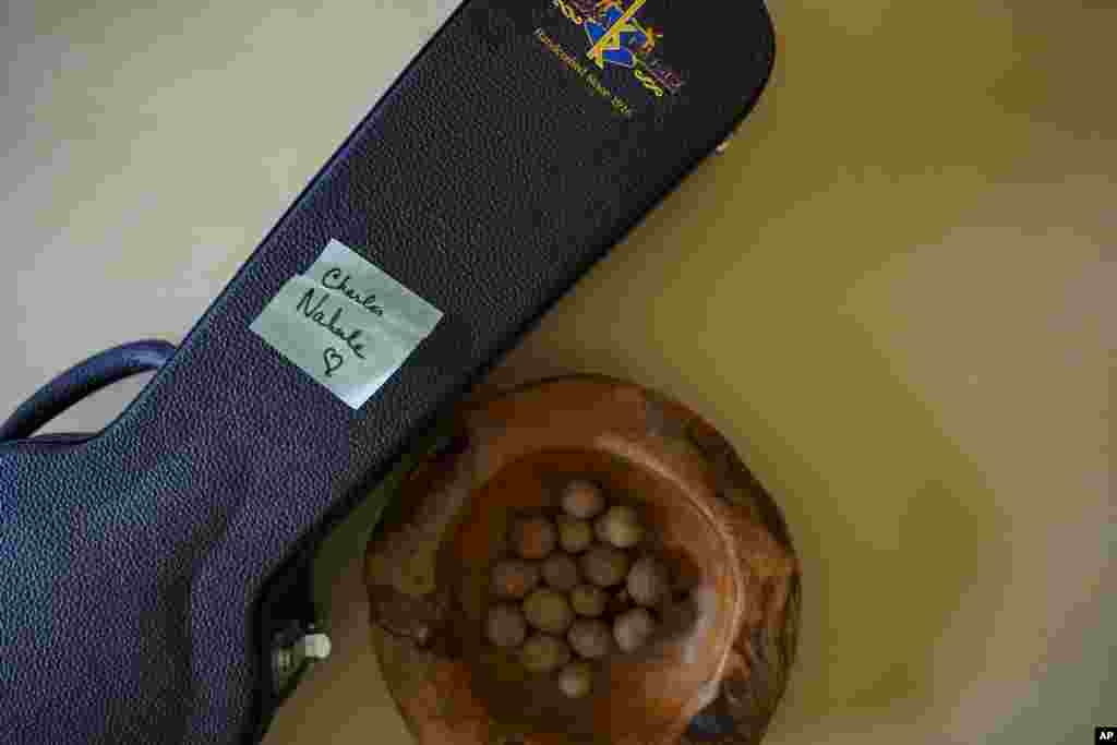 A sticky note is posted on a ukulele case gifted for Charles Nahale after he lost most of instruments from August's widlfrire on Tuesday, Oct. 10, 2023, in Lahaina, Hawaii. 