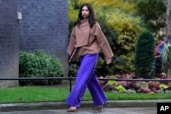 FILE - Britain's Home Secretary Suella Braverman arrives for a cabinet meeting at 10 Downing Street in London on Oct. 31, 2023. On Nov. 9, she accused London's Metropolitan Police of ignoring law-breaking by "pro-Palestinian mobs."