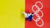 Brazil's Rafaela Silva, blue, and Mongolia's Sumiya Dorjsuren compete during the final of the women's 57 kg judo competition at the 2016 Summer Olympics in Rio de Janeiro, Brazil, Aug. 8, 2016. 