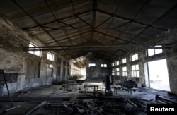 FILE - A closed brick factory building on the outskirts of Beijing, China, Jan. 18, 2016. Chinese manufacturing ebbed in January to its lowest in more than three years, a possible sign of further weakness in the world's No. 2 economy.